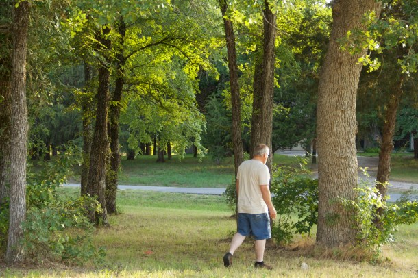 Hubby pacing out the possible dimensions of our house.  